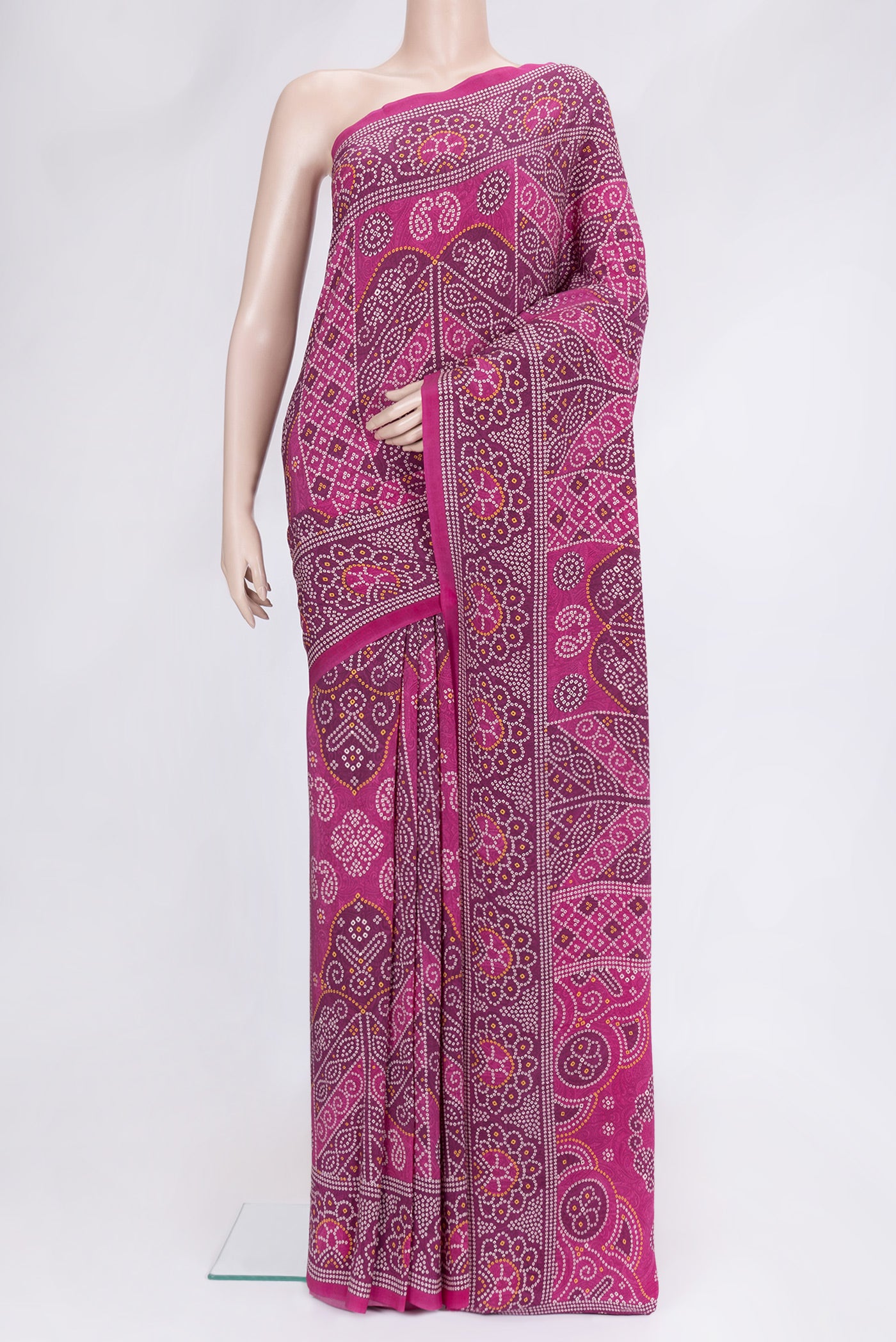 Pink Dual Tone Mysore Crepe Saree with Bandhani Print on the body and Printed Border.  displayed on a mannequin
