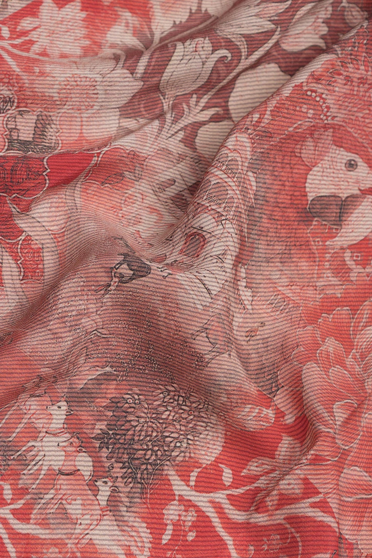 Close up of Orange Dual Tone Crepe Saree with Printed design on the body and Plain Border.  displaying folds