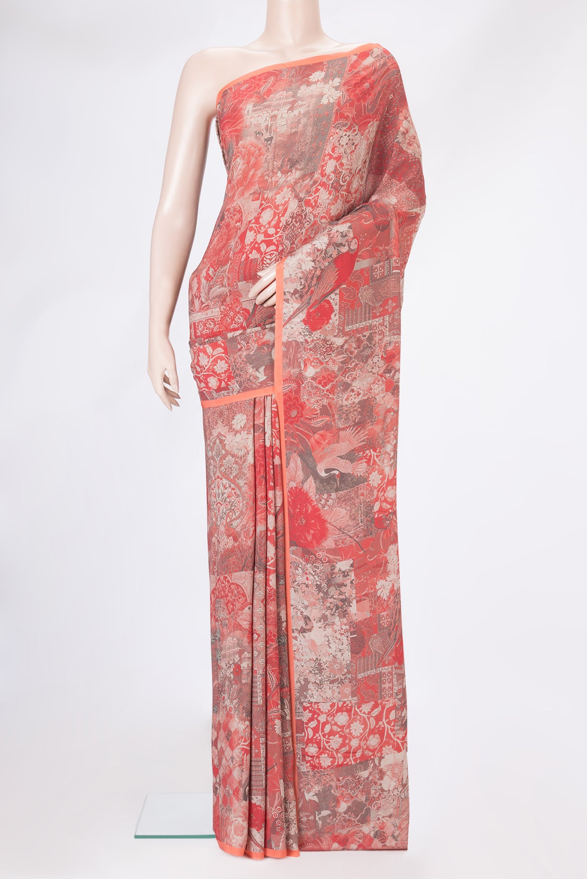 Orange Dual Tone Crepe Saree with Printed design on the body and Plain Border.  displayed on a mannequin