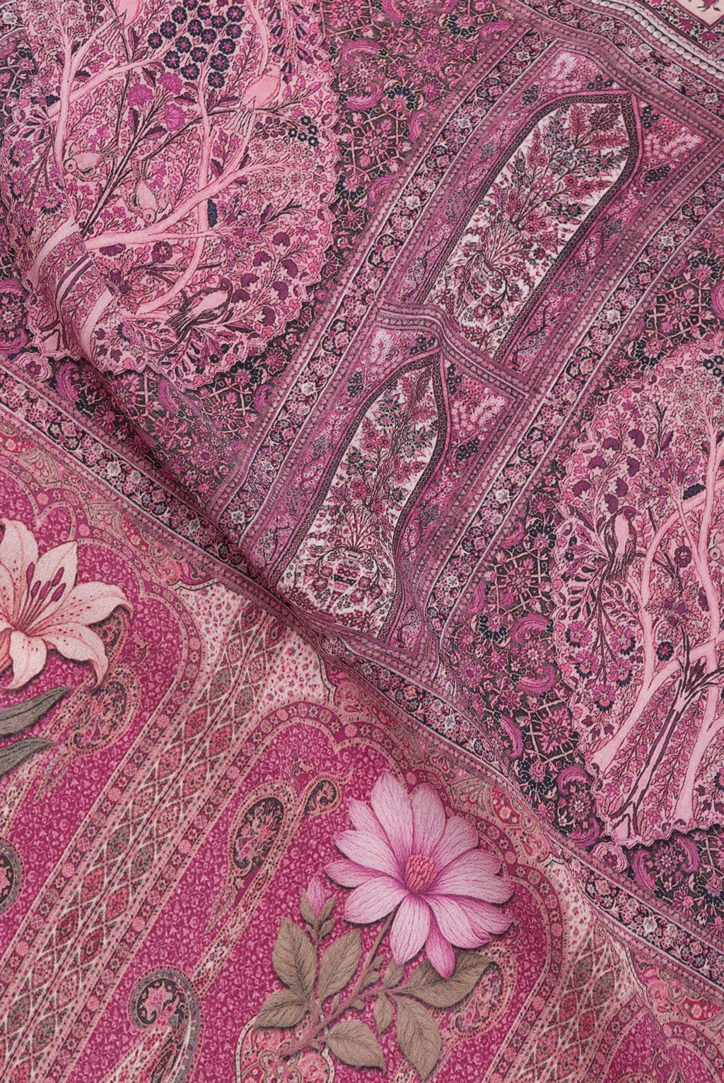 Close up of Purple Crepe Saree with Printed design on the body and Printed Border.  displaying folds