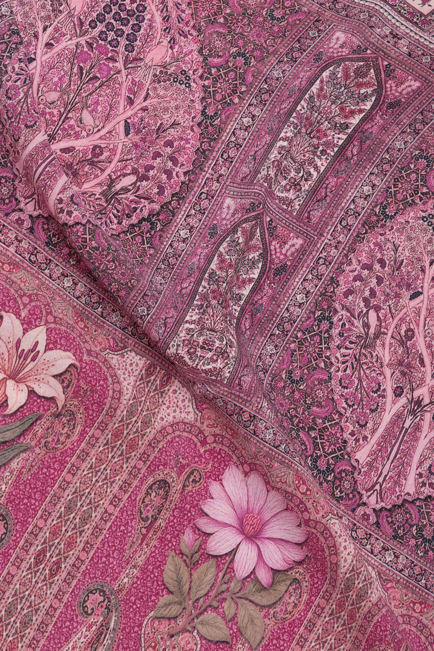Close up of Purple Crepe Saree with Printed design on the body and Printed Border.  displaying folds