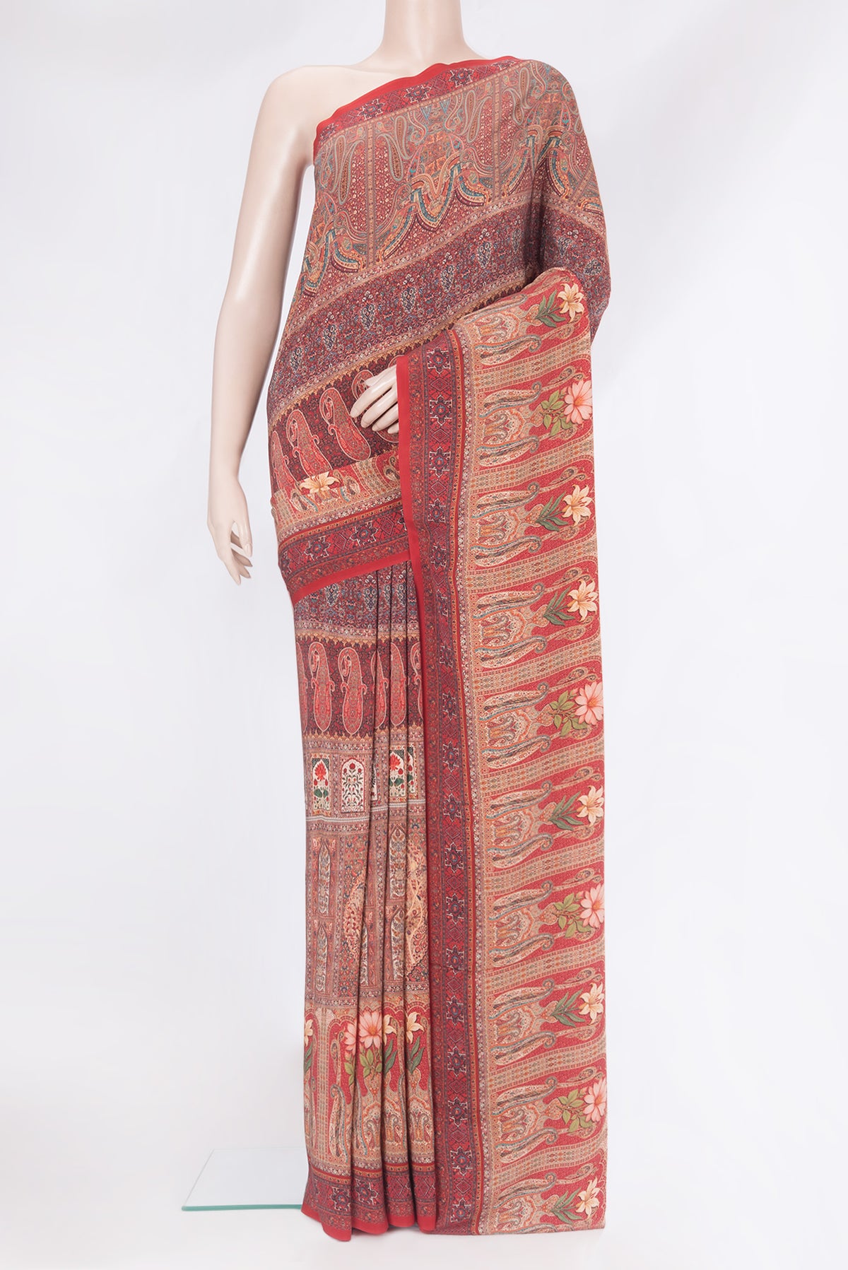Red Crepe Saree with Printed design on the body and Printed Border.  displayed on a mannequin