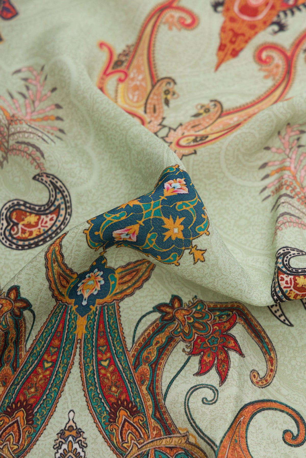 Close up of Light Green Dual Tone Mysore Crepe Saree with Printed design on the body and Without Border.  displaying folds
