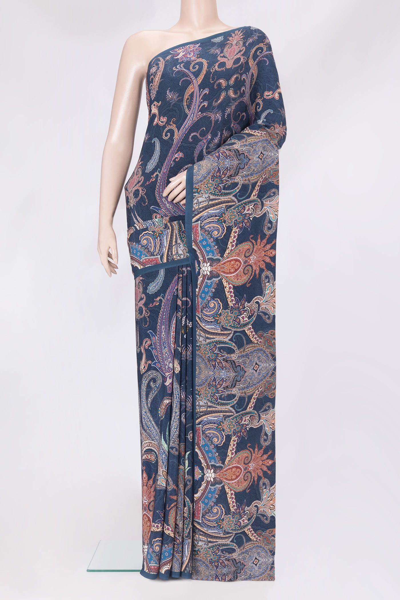 Navy Blue Crepe Saree with Printed design on the body and Plain Border.  displayed on a mannequin