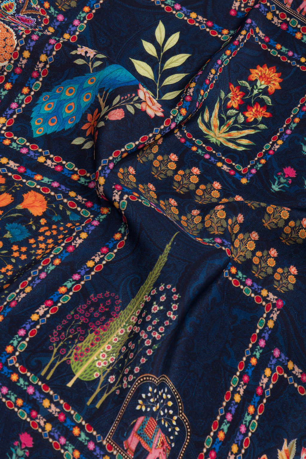 Close up of Navy Blue Crepe Saree with Printed design on the body and Without Border.  displaying folds