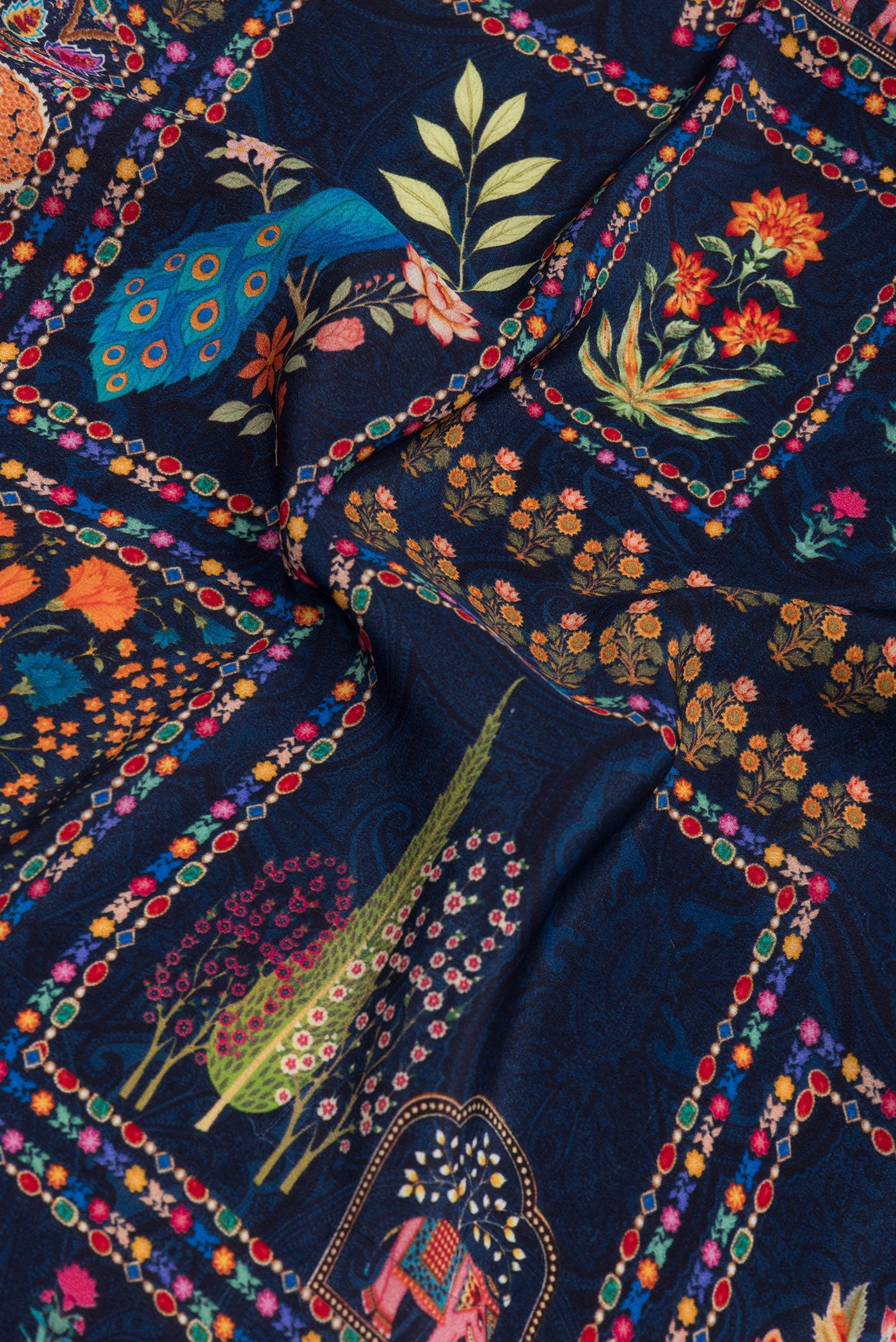 Close up of Navy Blue Crepe Saree with Printed design on the body and Without Border.  displaying folds