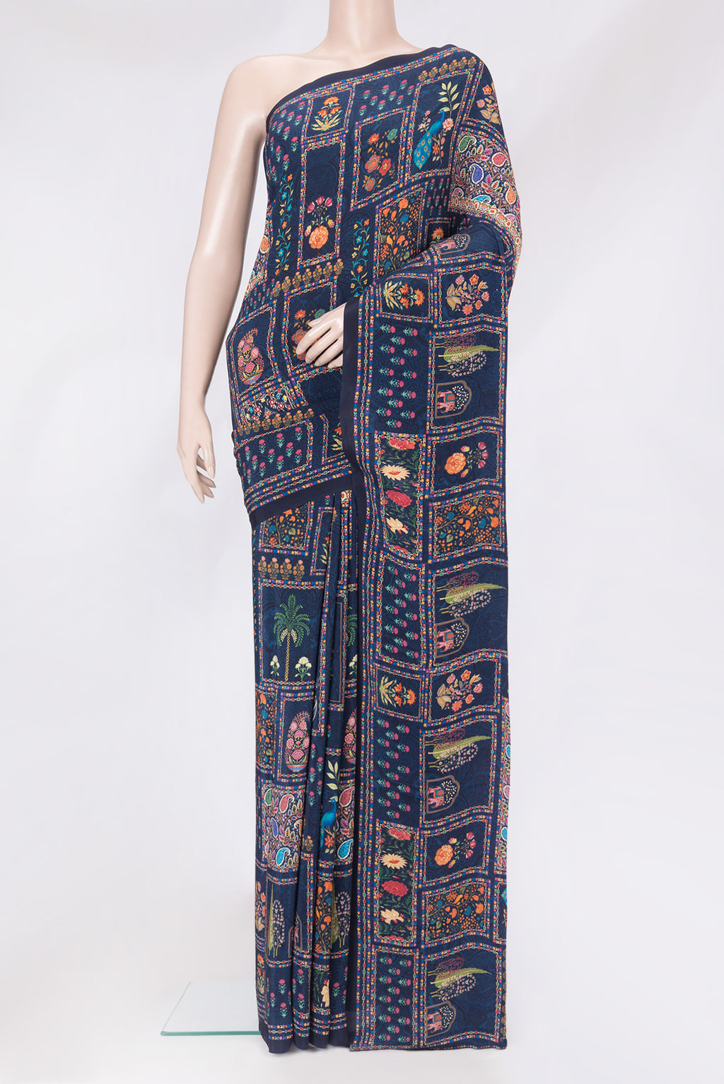Navy Blue Crepe Saree with Printed design on the body and Without Border.  displayed on a mannequin
