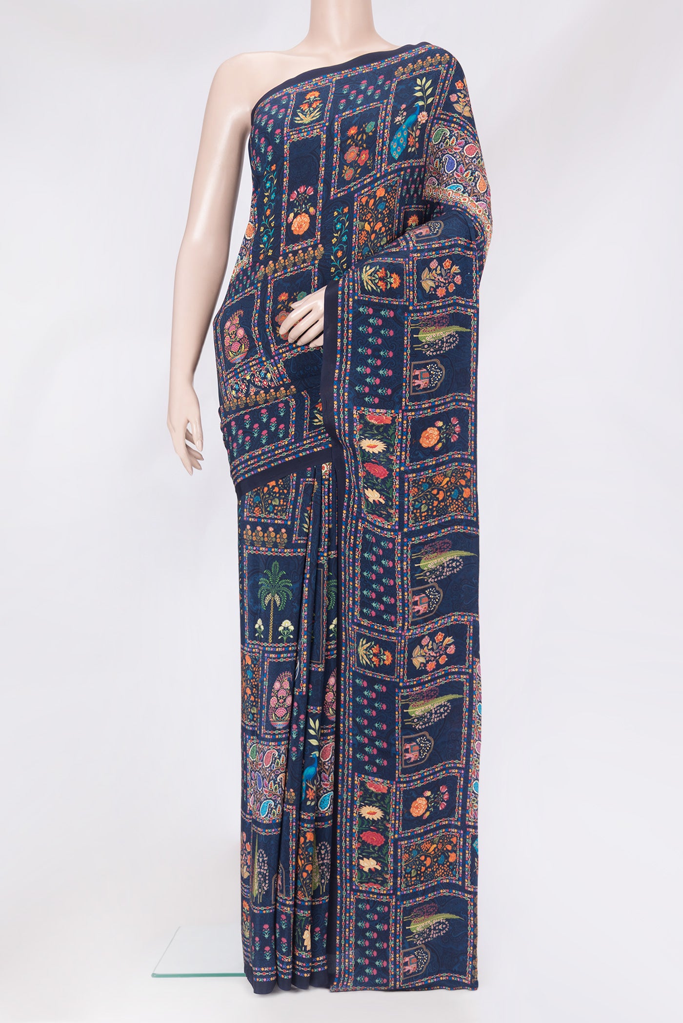 Navy Blue Crepe Saree with Printed design on the body and Without Border.  displayed on a mannequin