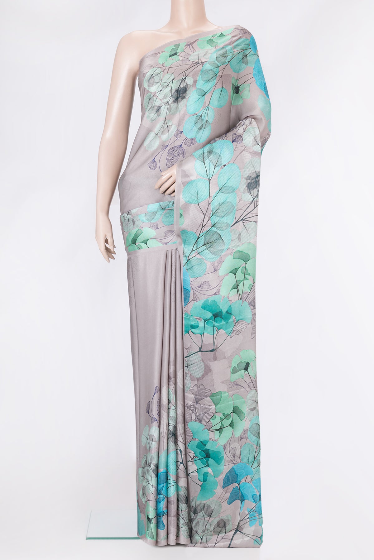 Grey Dual Tone Crepe Saree with Printed design on the body and Without Border.  displayed on a mannequin
