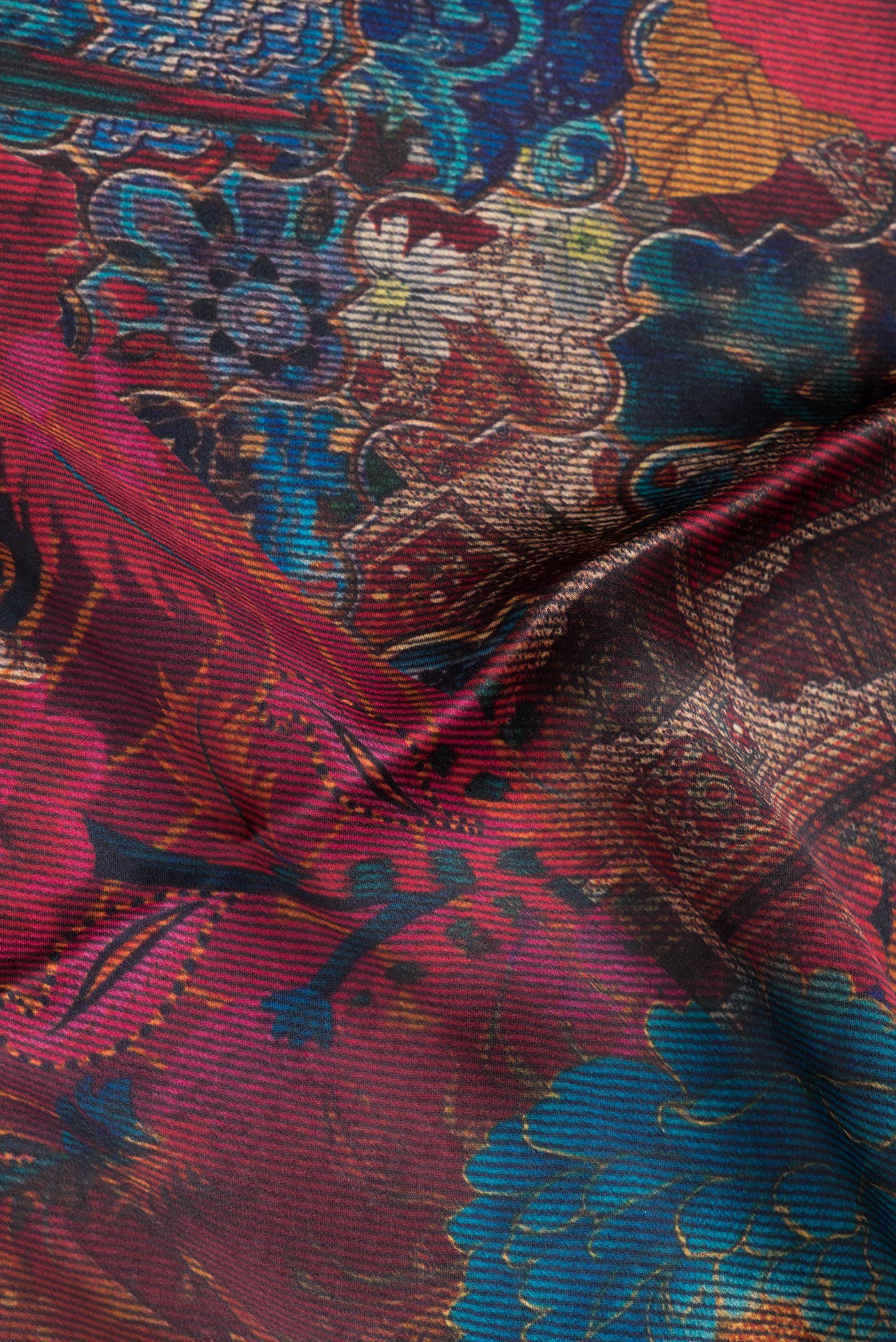 Close up of Maroon Dual Tone Mysore Crepe Saree with Printed design on the body and Without Border.  displaying folds