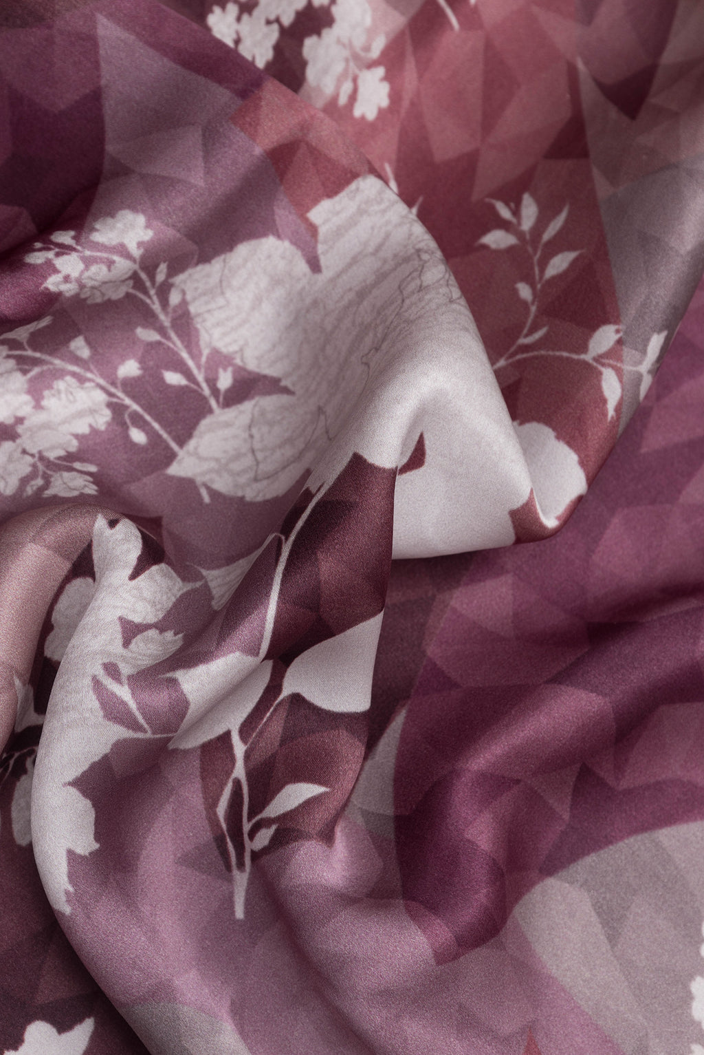 Close up of Brown Dual Tone Crepe Saree with Printed design on the body and Plain Border.  displaying folds