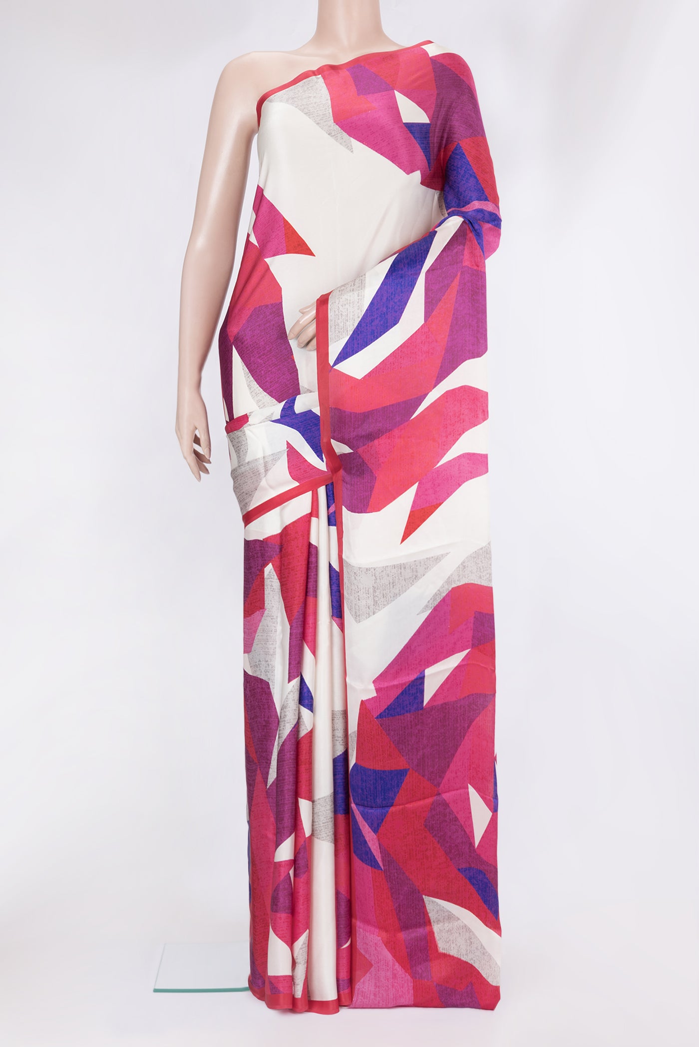 Multi Color Crepe Saree with Printed design on the body and Plain Border.  displayed on a mannequin
