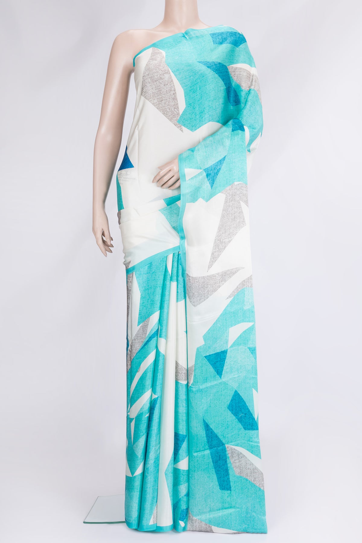Beige Dual Tone Mysore Crepe Saree with Printed design on the body and Printed Border.  displayed on a mannequin