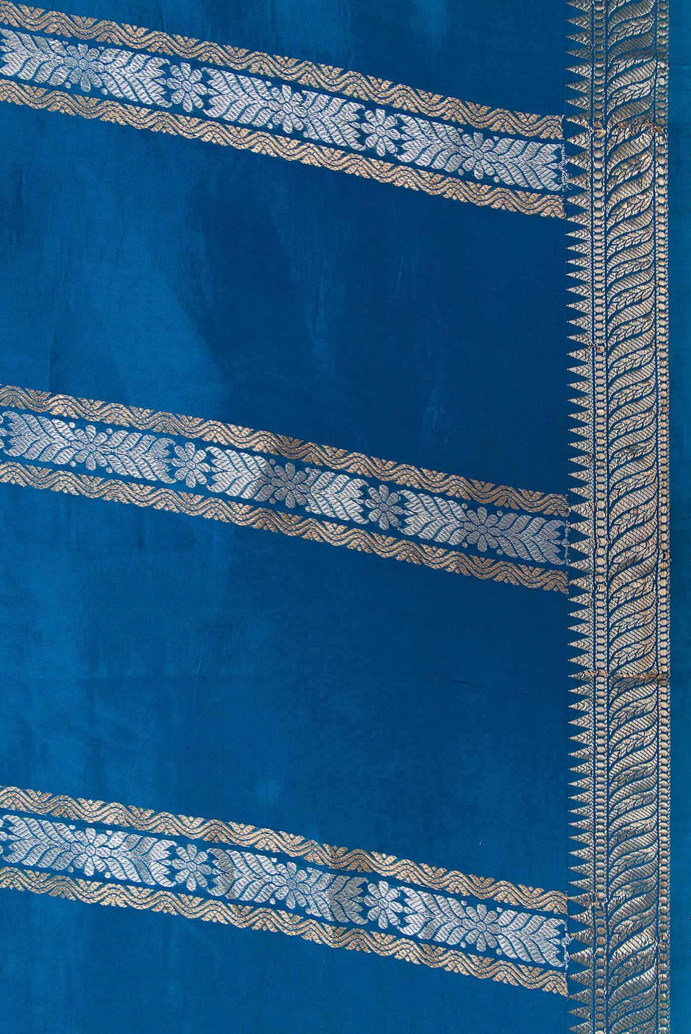 Border image of Peacock Blue Dual Tone Tussar Silk Saree with Stripes on the body and Zari Border. 