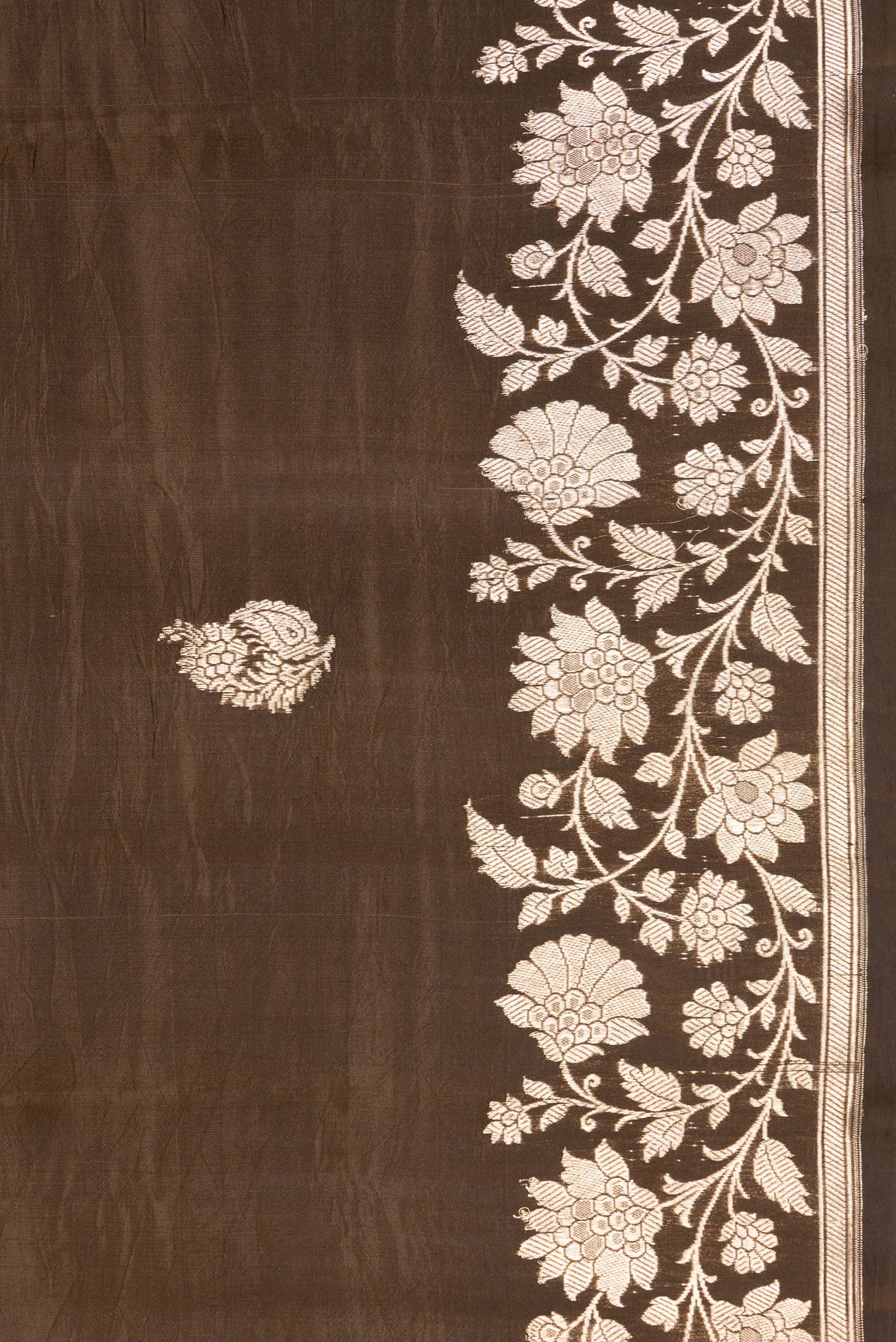 Border image of Brown Dual Tone Tussar Silk Saree with Zari Butta on the body and Zari Border. 