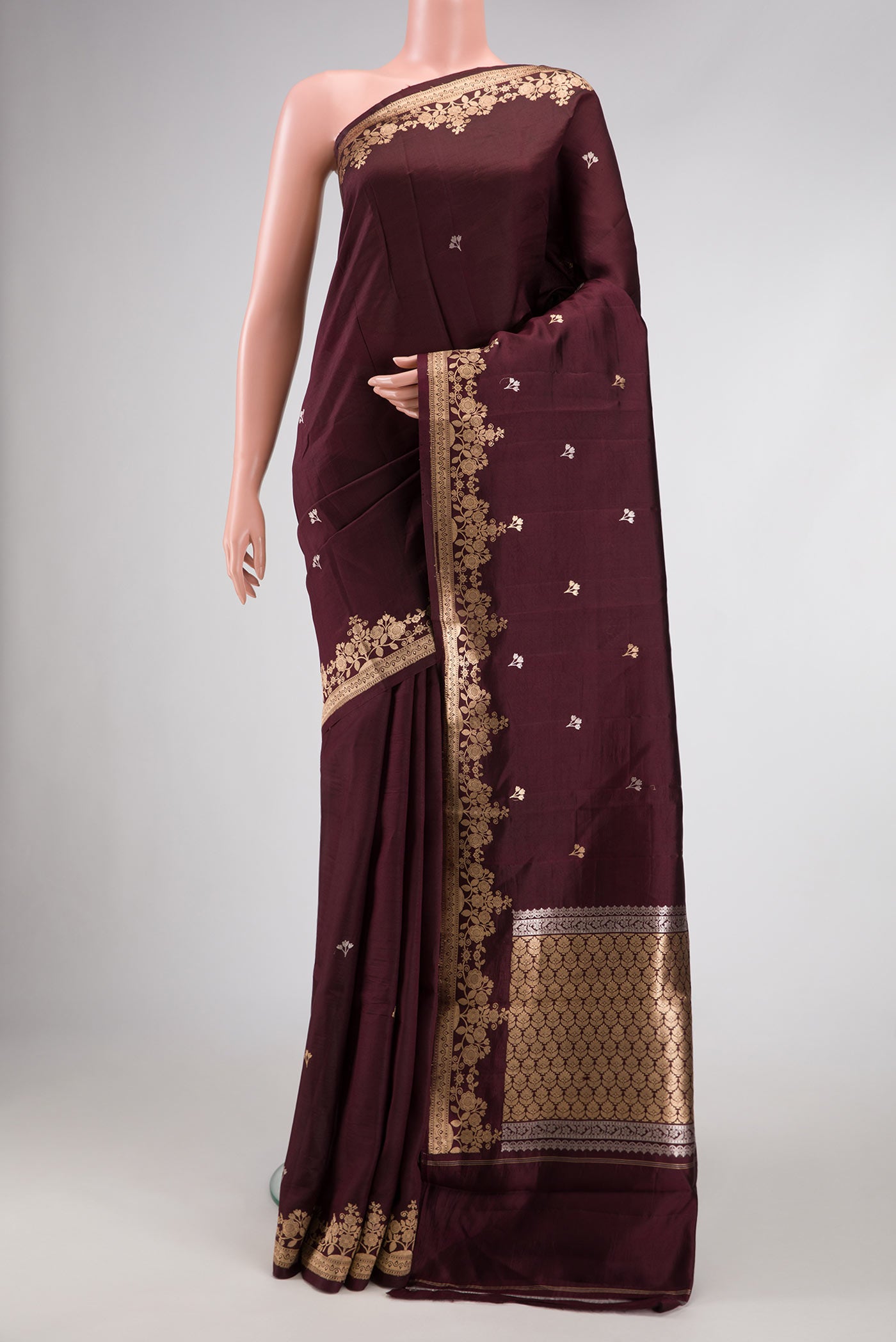 Coffee Brown Dual Tone Tussar Silk Saree with Zari Butta on the body and Fancy Border.  displayed on a mannequin