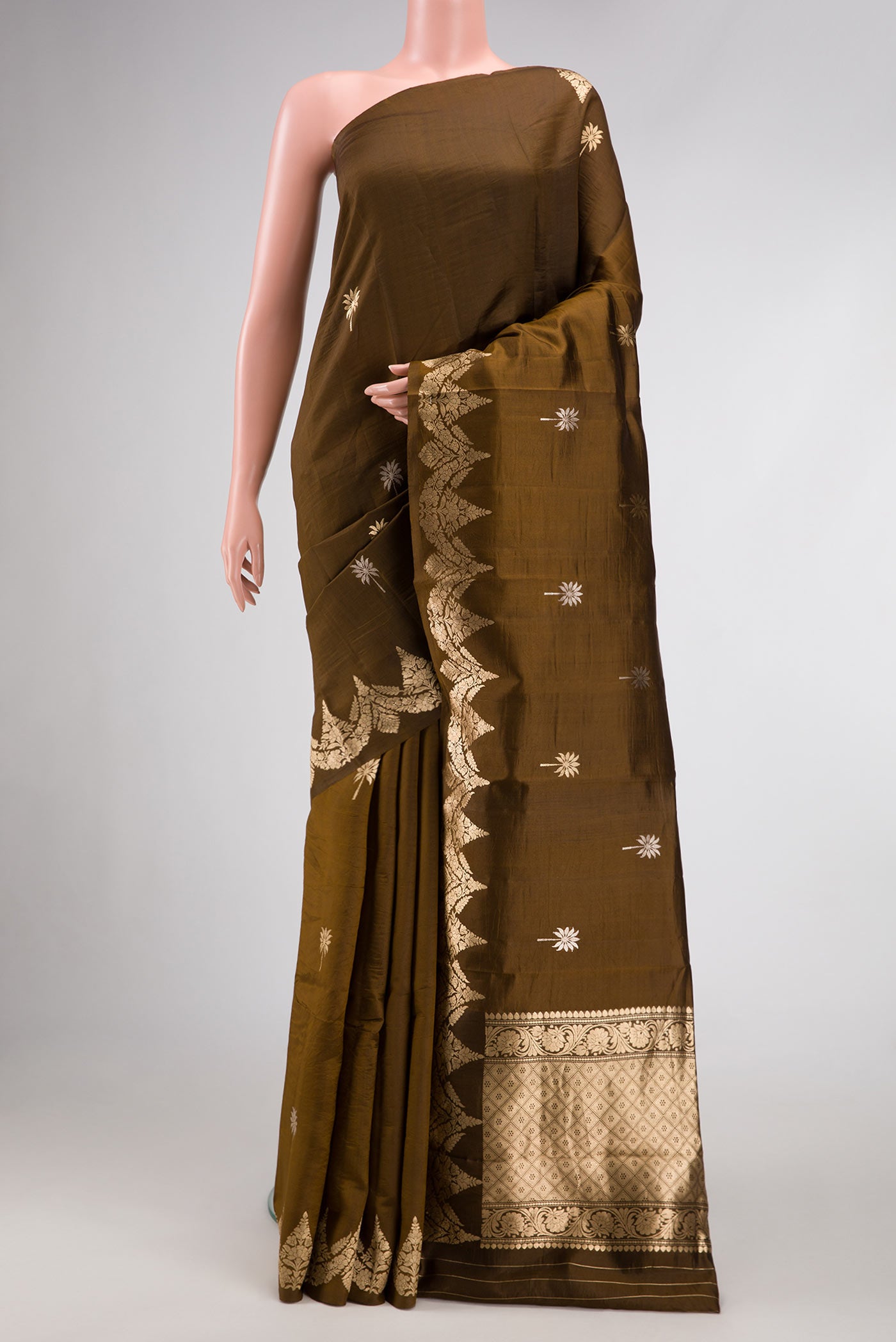 Brown Dual Tone Tussar Silk Saree with Zari Butta on the body and Fancy Border.  displayed on a mannequin