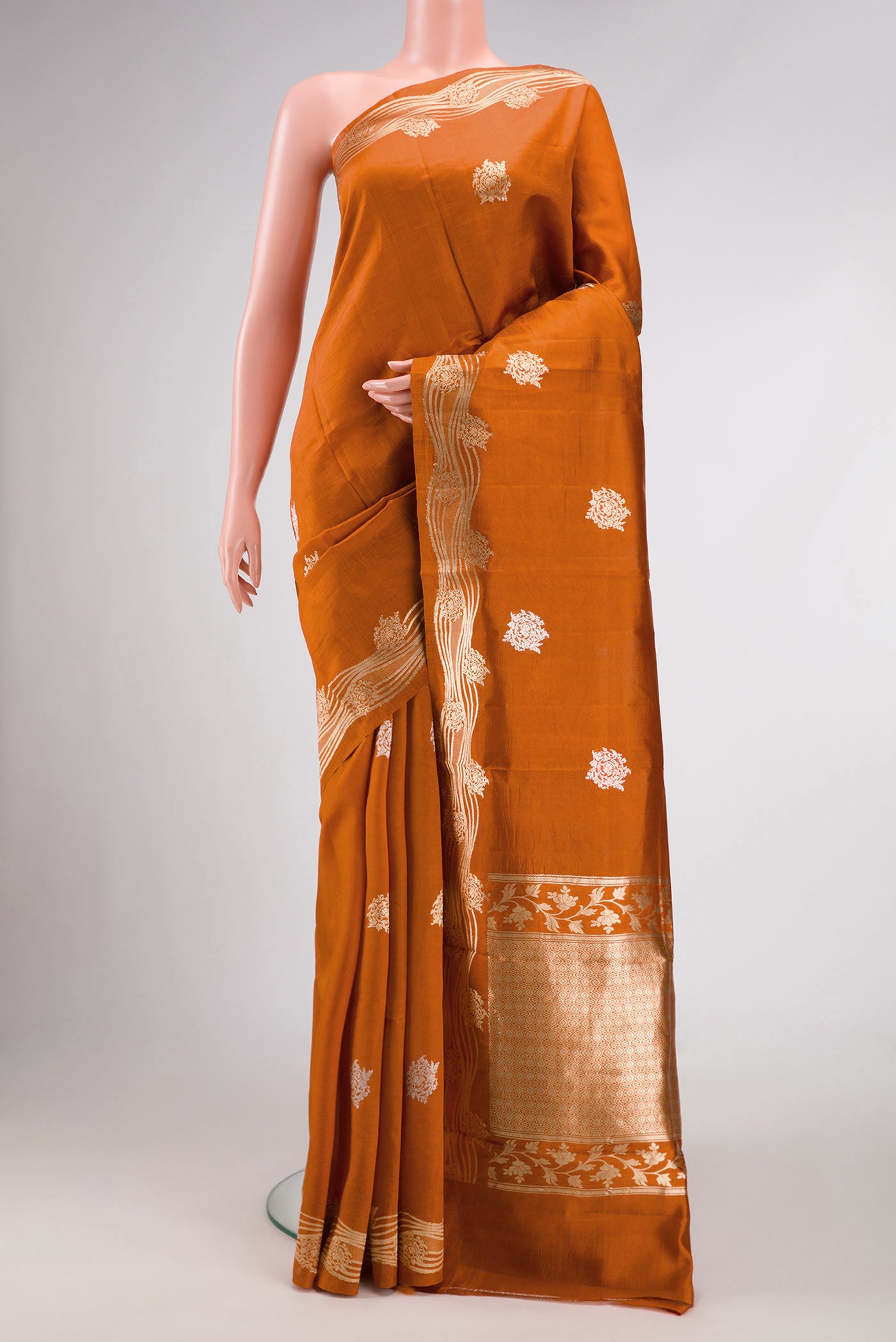 Orange Dual Tone Tussar Silk Saree with Zari Butta on the body and Fancy Border.  displayed on a mannequin