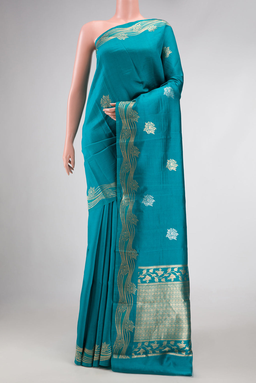 Peacock Blue Dual Tone Tussar Silk Saree with Zari Butta on the body and Zari Border.  displayed on a mannequin