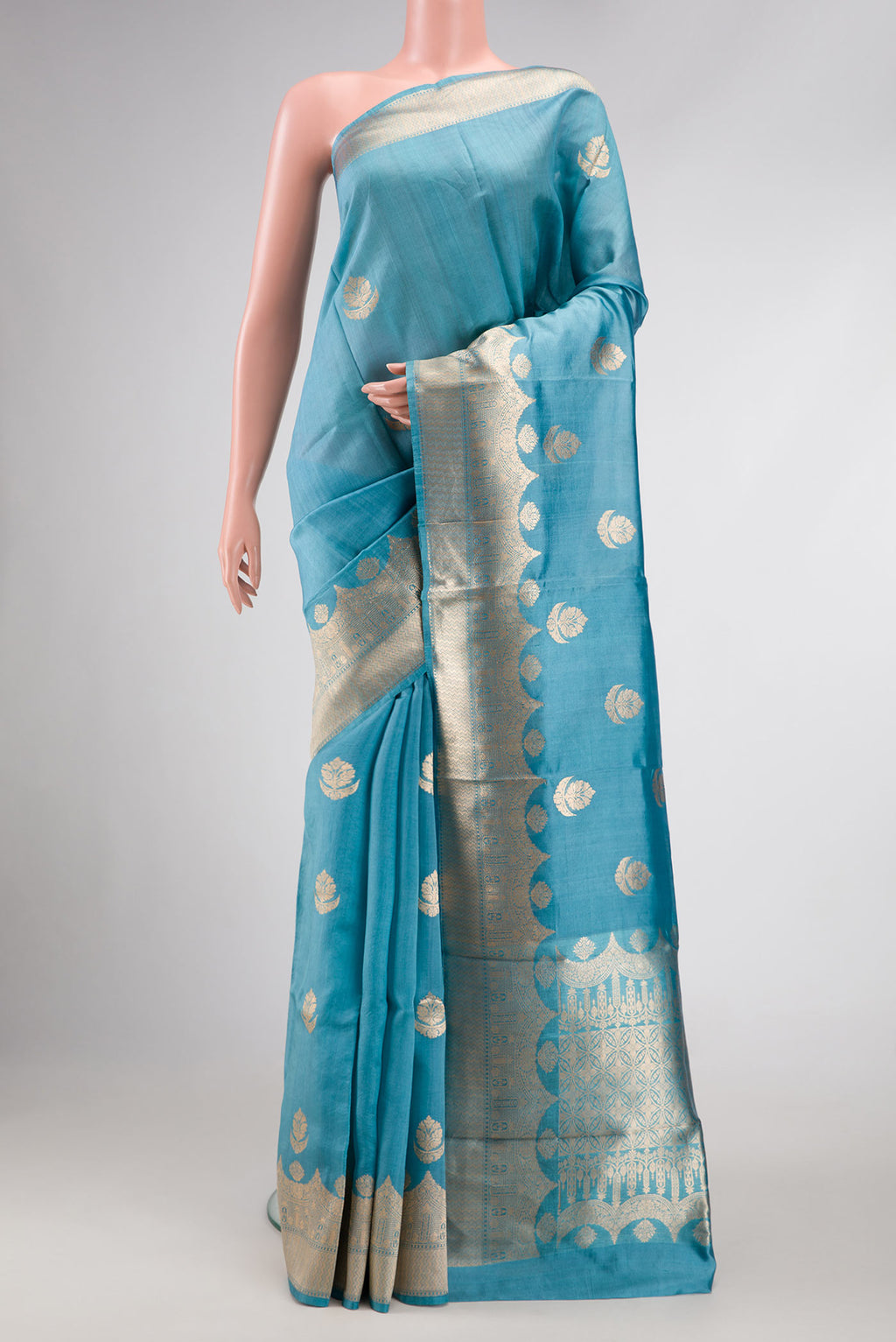 Grey Dual Tone Tussar Silk Saree with Zari Butta on the body and Fancy Border.  displayed on a mannequin