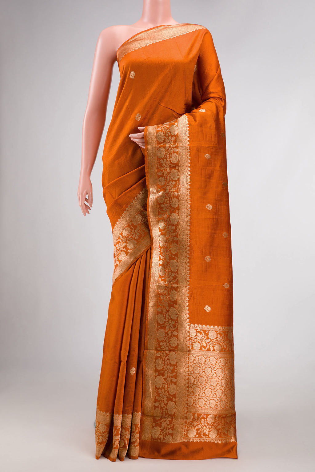 Orange Dual Tone Tussar Silk Saree with Zari Butta on the body and Zari Border.  displayed on a mannequin