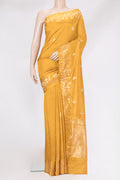 Mustard Dual Tone Tussar Silk Saree with Zari Butta on the body and Fancy Border.  displayed on a mannequin
