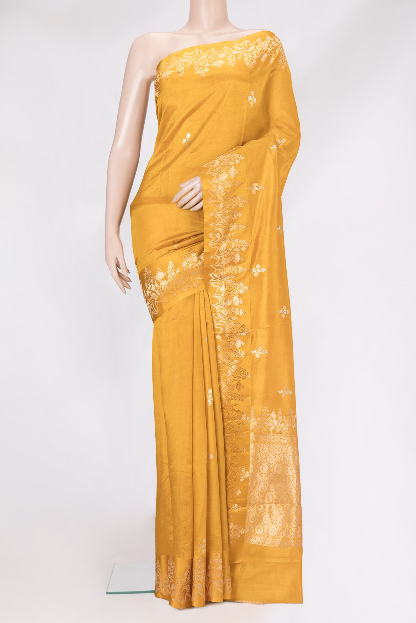 Mustard Dual Tone Tussar Silk Saree with Zari Butta on the body and Fancy Border.  displayed on a mannequin