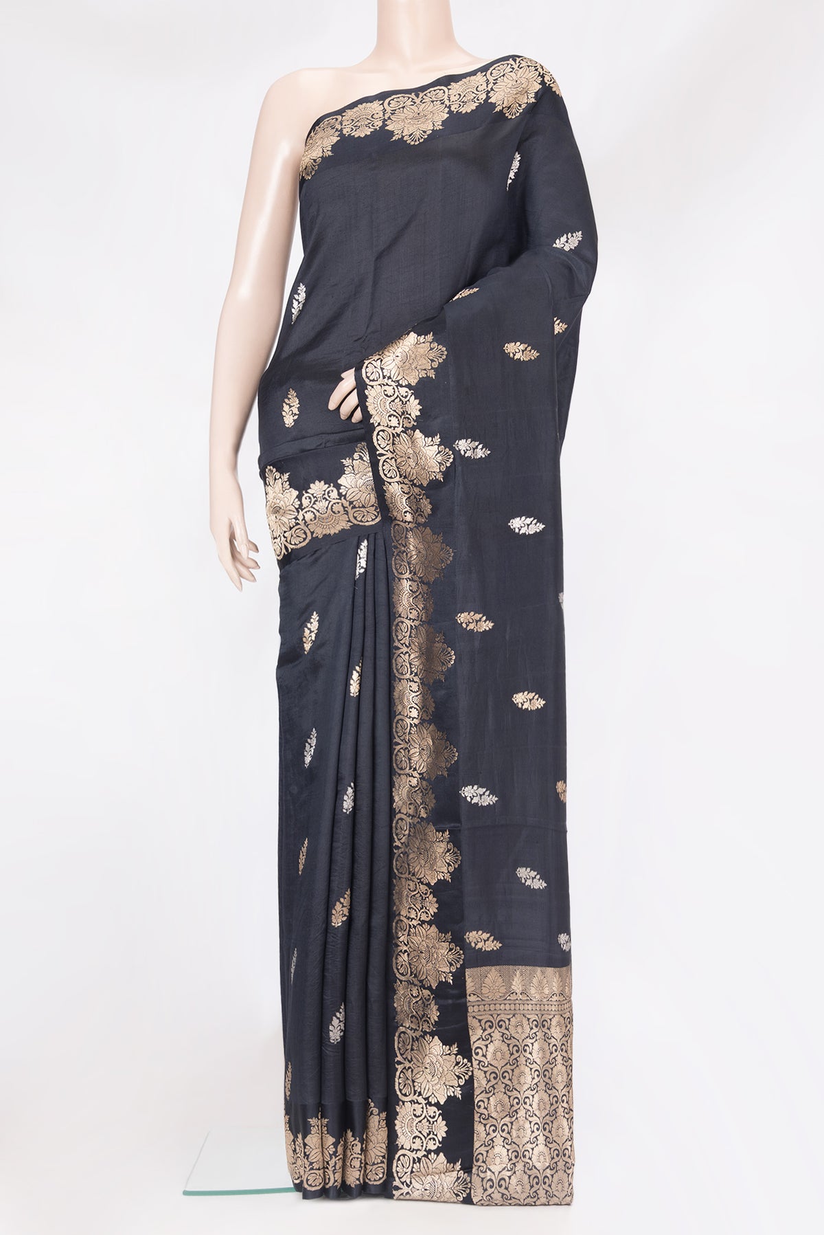 Black Dual Tone Tussar Silk Saree with Zari Butta on the body and Fancy Border.  displayed on a mannequin