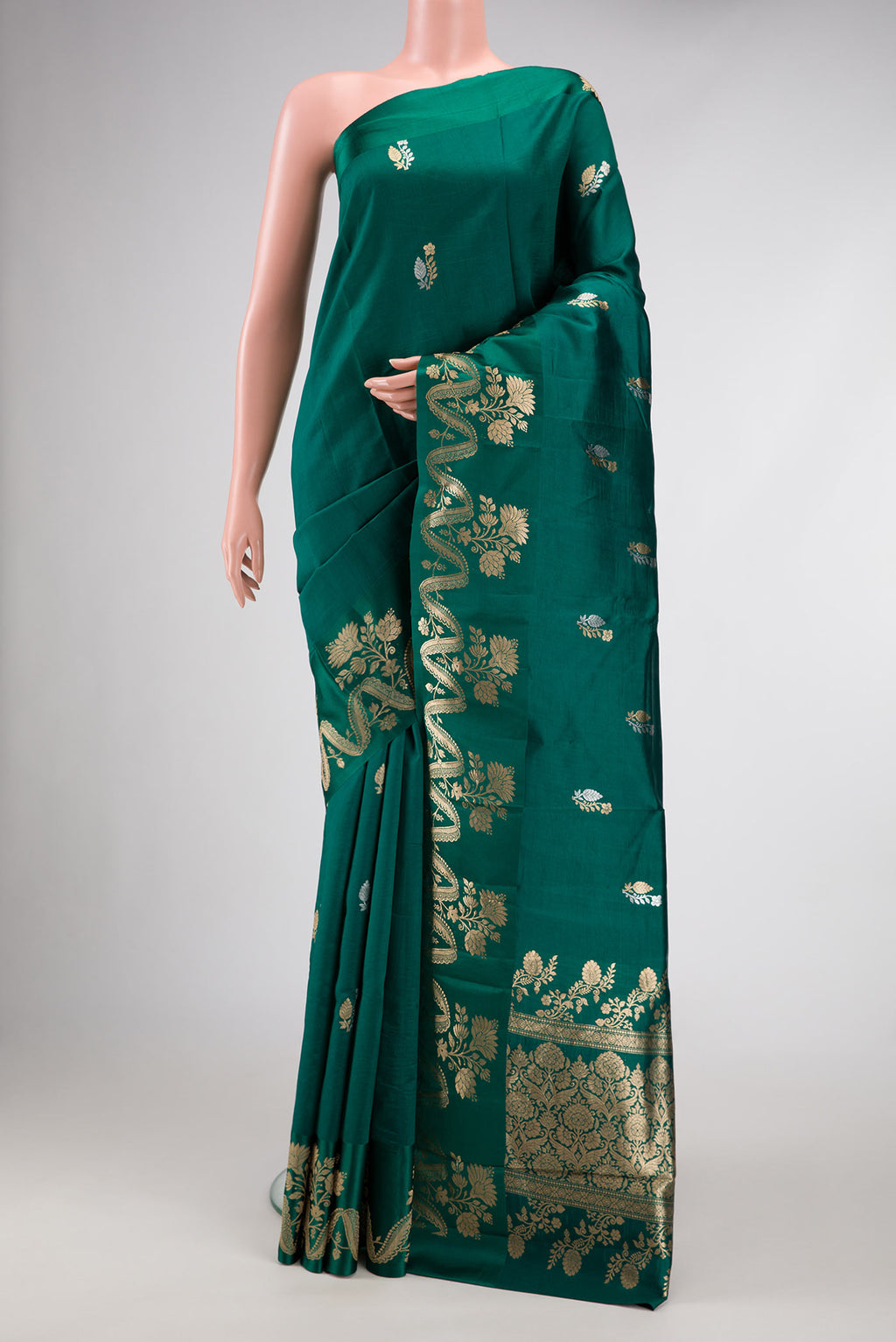 Bottle Green Dual Tone Tussar Silk Saree with Zari Butta on the body and Fancy Border.  displayed on a mannequin