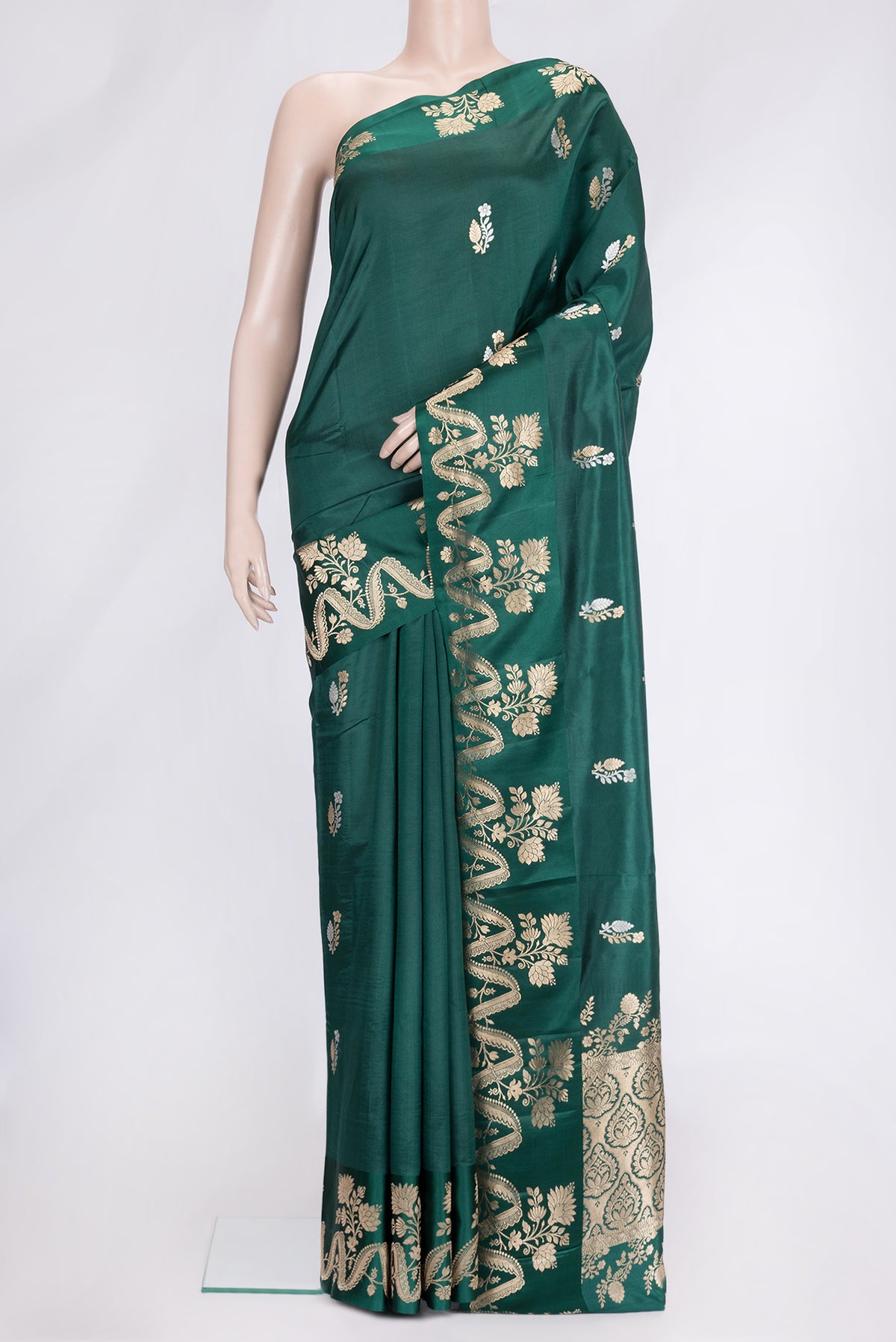 Bottle Green Dual Tone Tussar Silk Saree with Zari Butta on the body and Fancy Border.  displayed on a mannequin