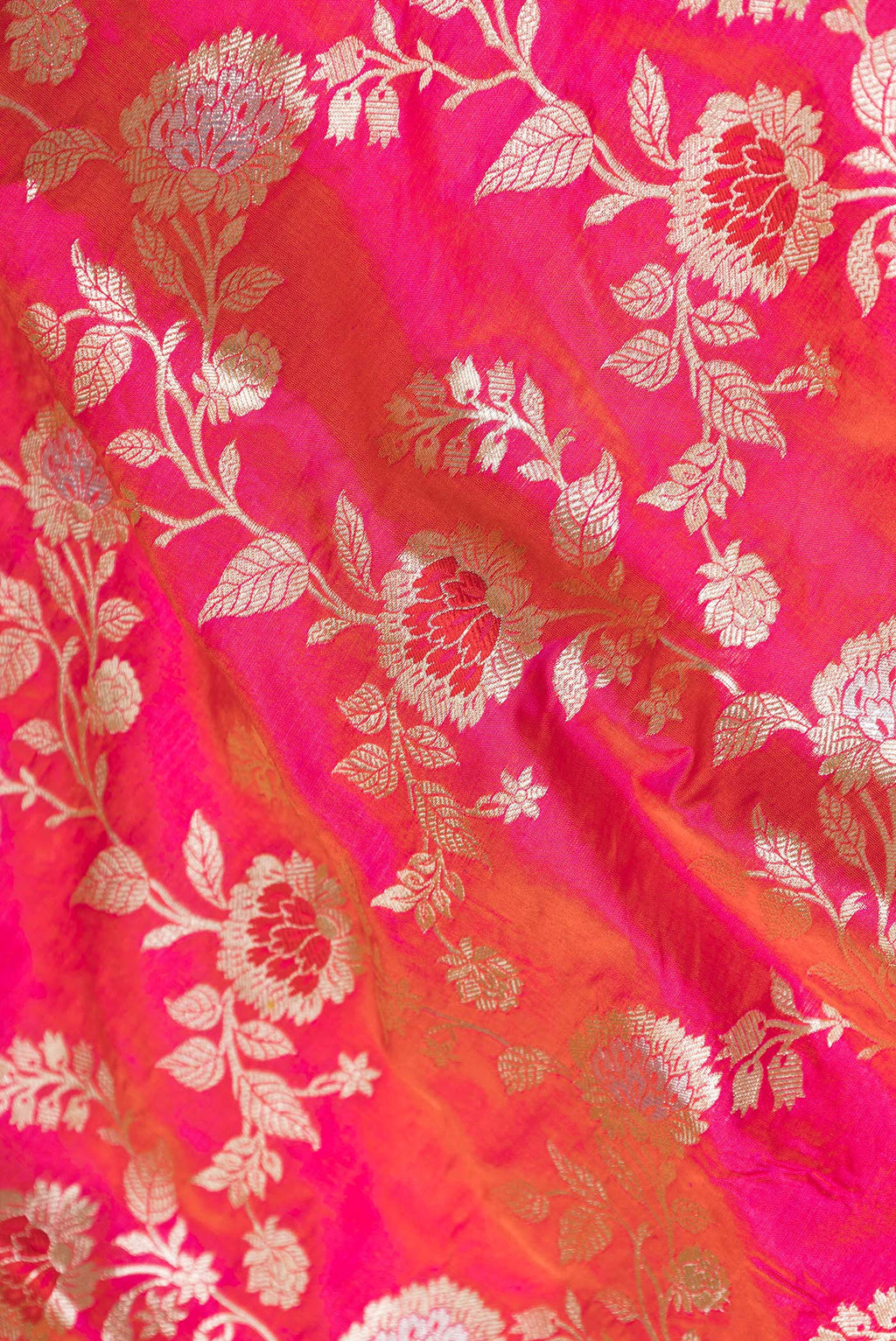 Close up of Pink Dual Tone Banarasi Silk Saree with Zari Brocade on the body and Zari Border.  displaying folds