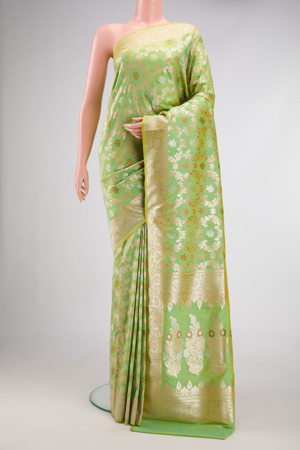 Pista Green Dual Tone Blended Banarasi Silk Saree with Zari Brocade on the body and Zari Border.  displayed on a mannequin
