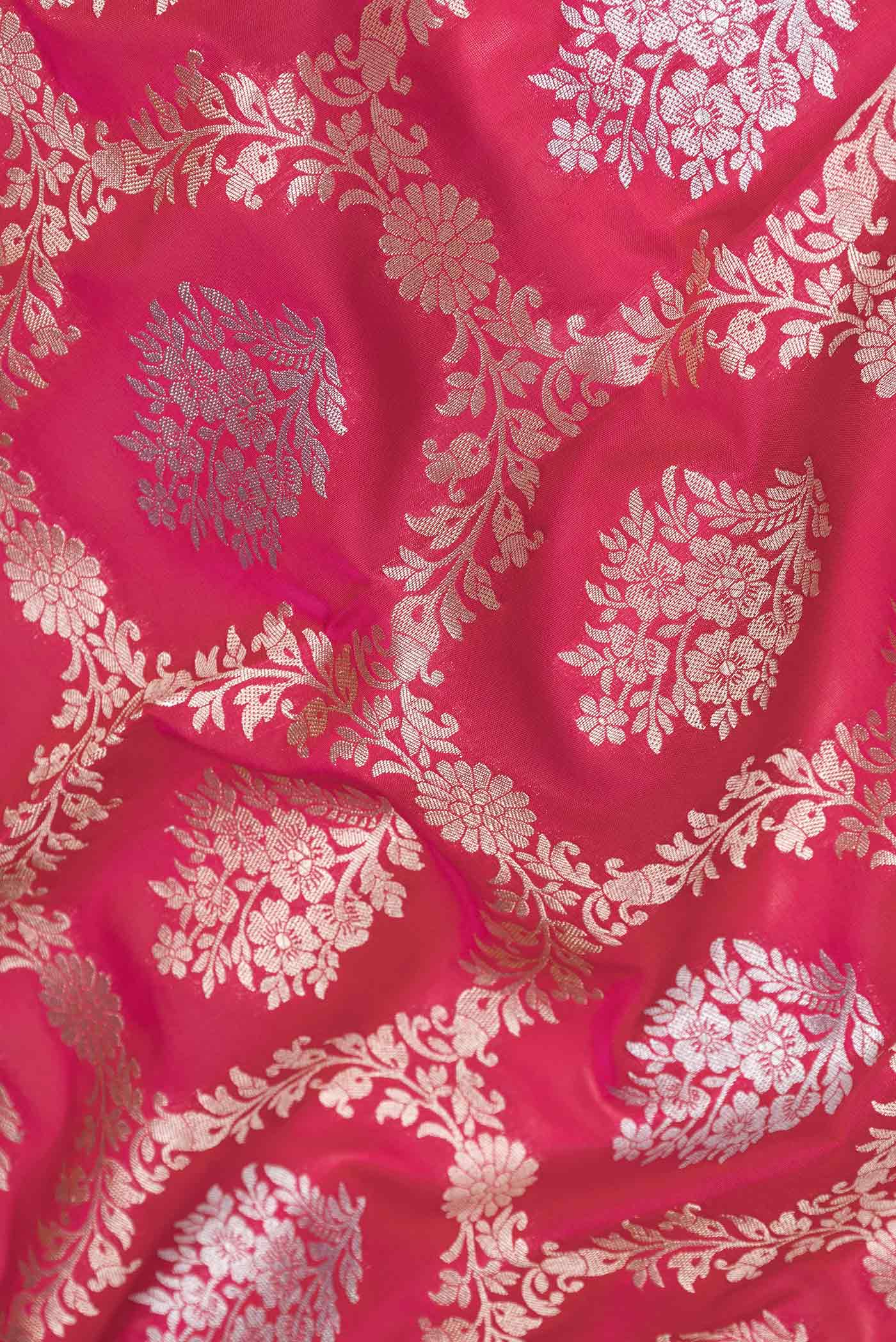 Close up of Dark Pink Dual Tone Blended Banarasi Saree with Zari Brocade on the body and Zari Border.  displaying folds