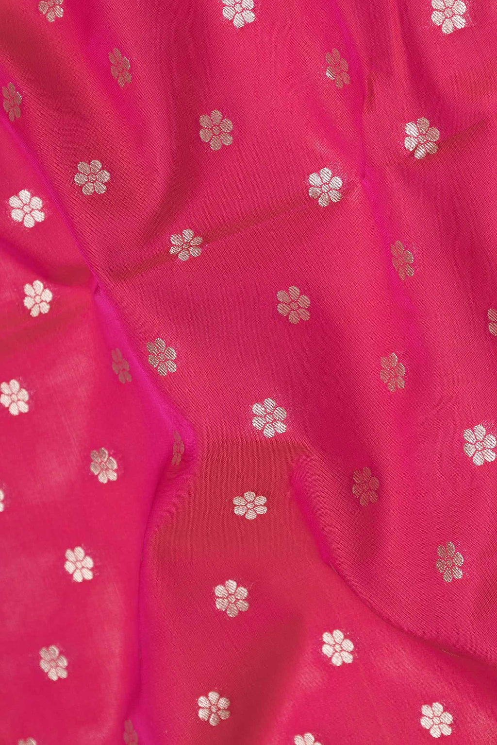 Close up of Pink Dual Tone Blended Banarasi Saree with Zari Butta on the body and Zari Border.  displaying folds