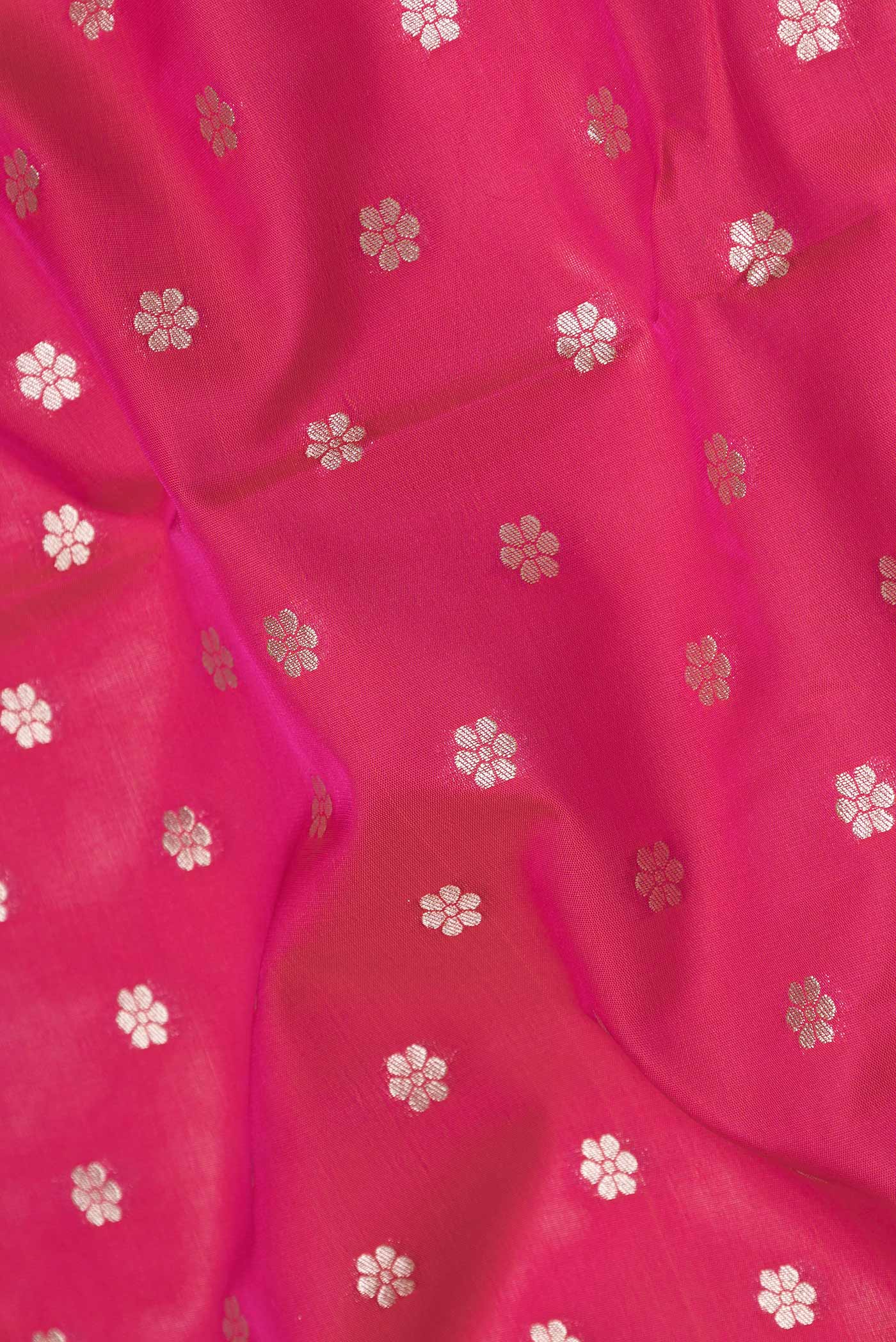 Close up of Pink Dual Tone Blended Banarasi Saree with Zari Butta on the body and Zari Border.  displaying folds