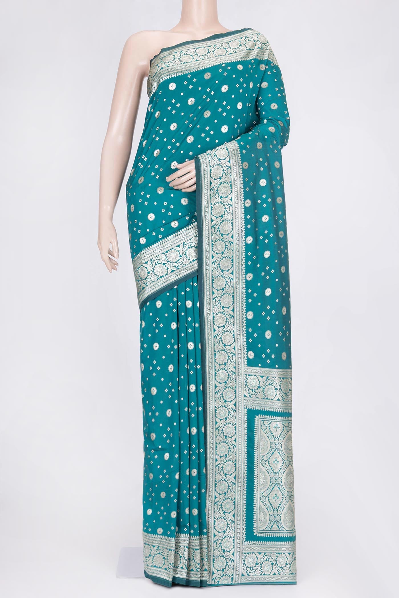 Peacock Blue Dual Tone Blended Banarasi Saree with Zari Butta on the body and Zari Border.  displayed on a mannequin