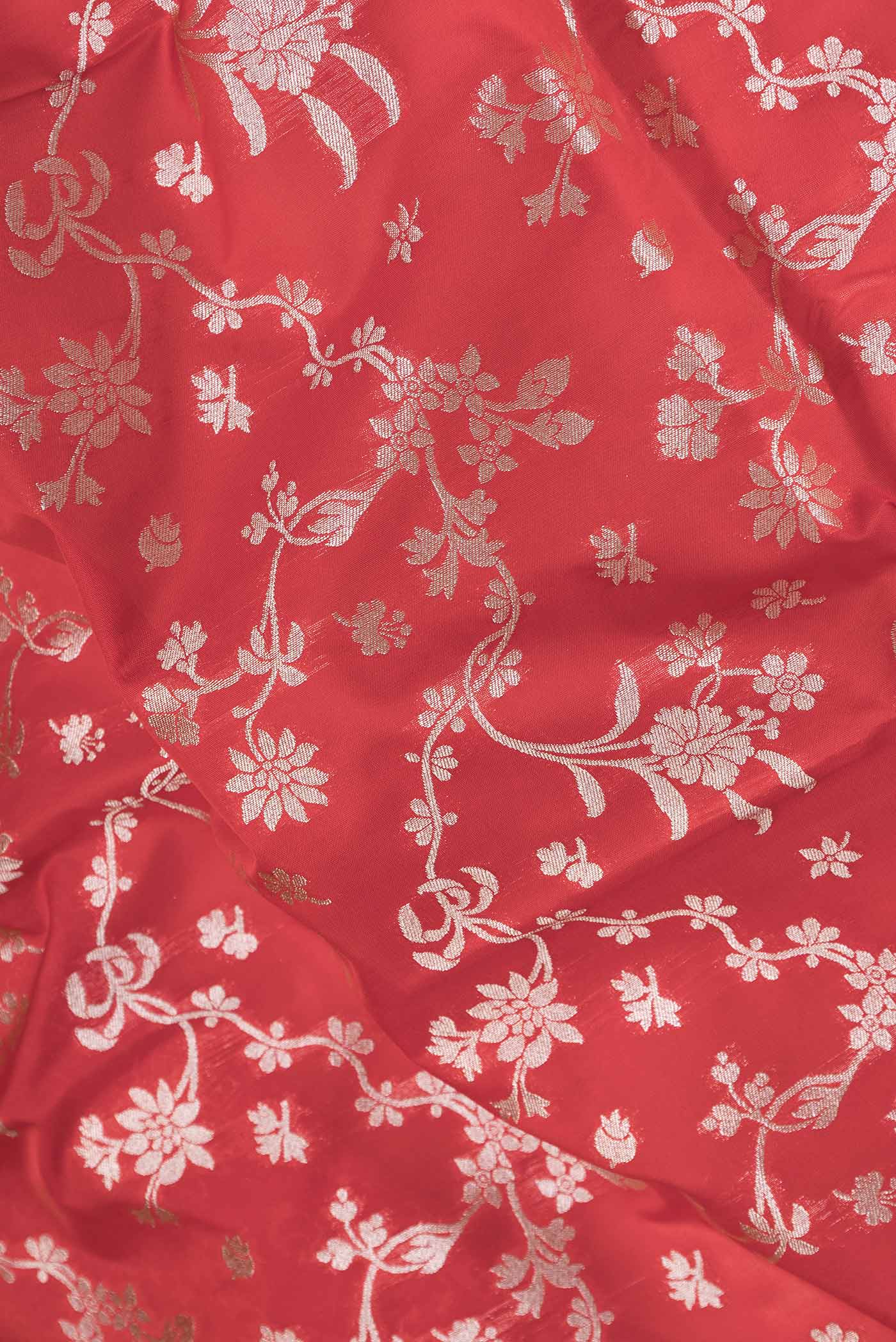 Close up of Red Dual Tone Blended Banarasi Saree with Zari Brocade on the body and Zari Border.  displaying folds