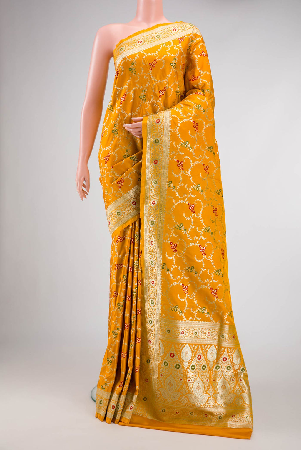 Mustard Dual Tone Blended Banarasi Silk Saree with Zari Brocade on the body and Zari Border.  displayed on a mannequin