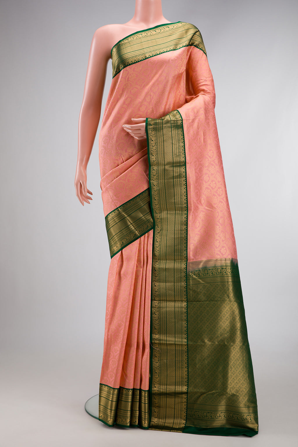 Peach Dual Tone Kanjivaram Silk Saree with Zari Brocade on the body and Zari Border.  displayed on a mannequin