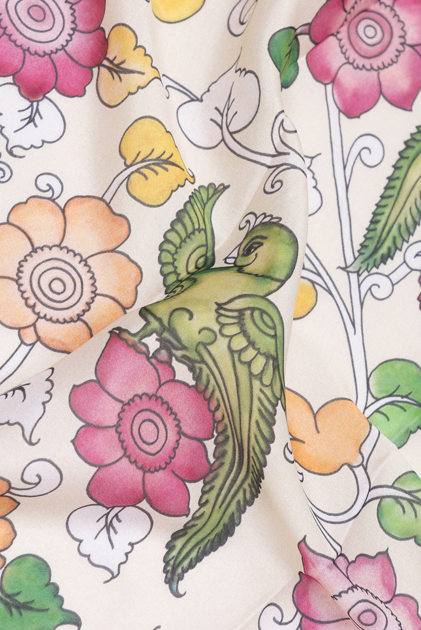 Close up of Beige Mysore Silk Saree with kalamkari Print on the body and Fancy Border.  displaying folds