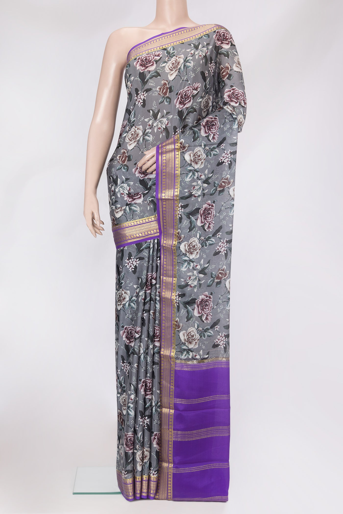 Grey Mysore Silk Saree with Printed design on the body and Zari Border.  displayed on a mannequin