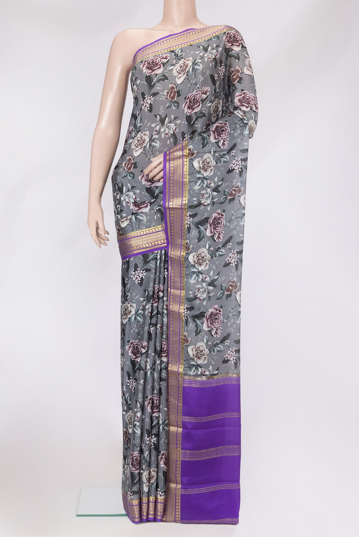 Grey Mysore Silk Saree with Printed design on the body and Zari Border.  displayed on a mannequin
