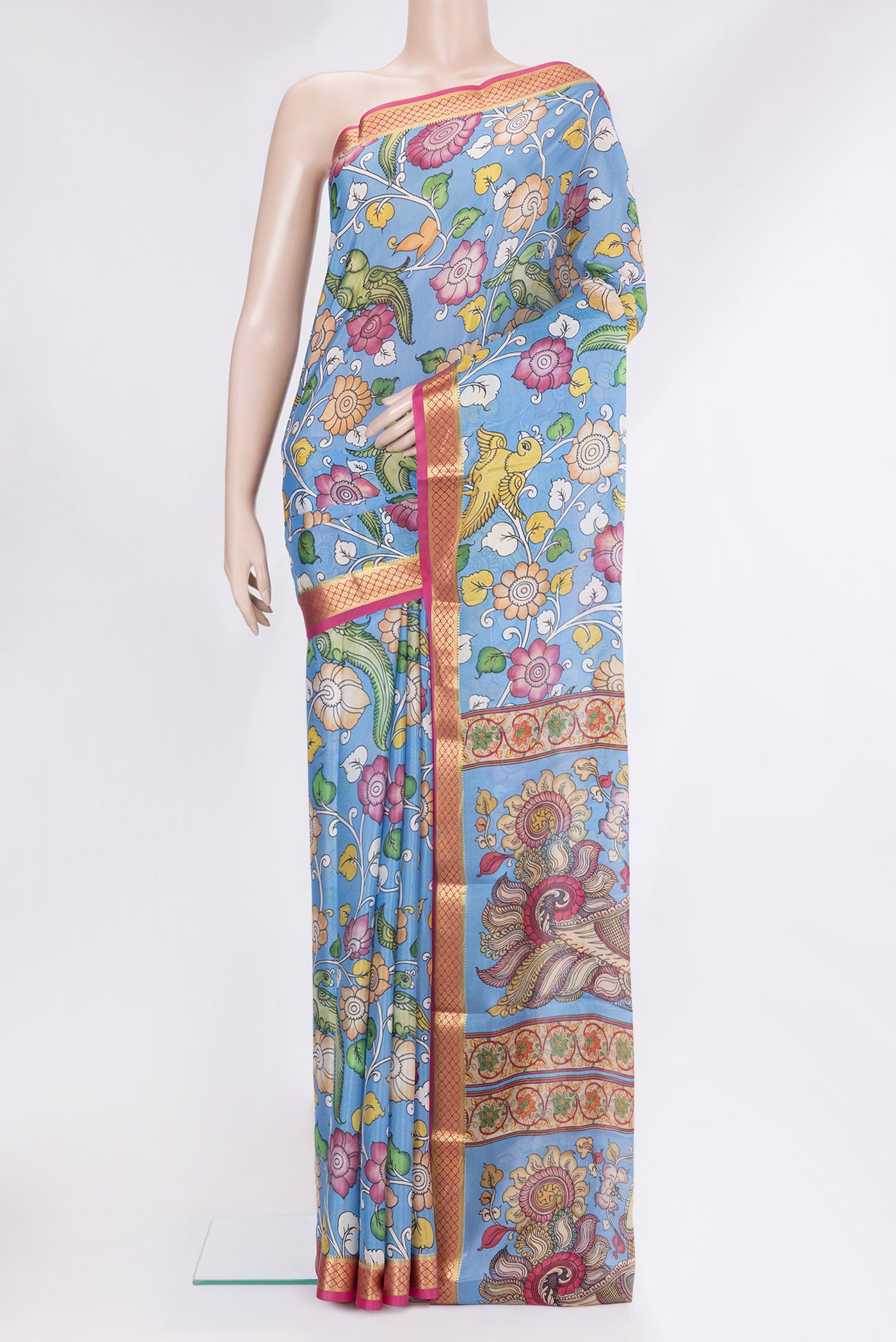 Blue Mysore Silk Saree with kalamkari Print on the body and Zari Border.  displayed on a mannequin