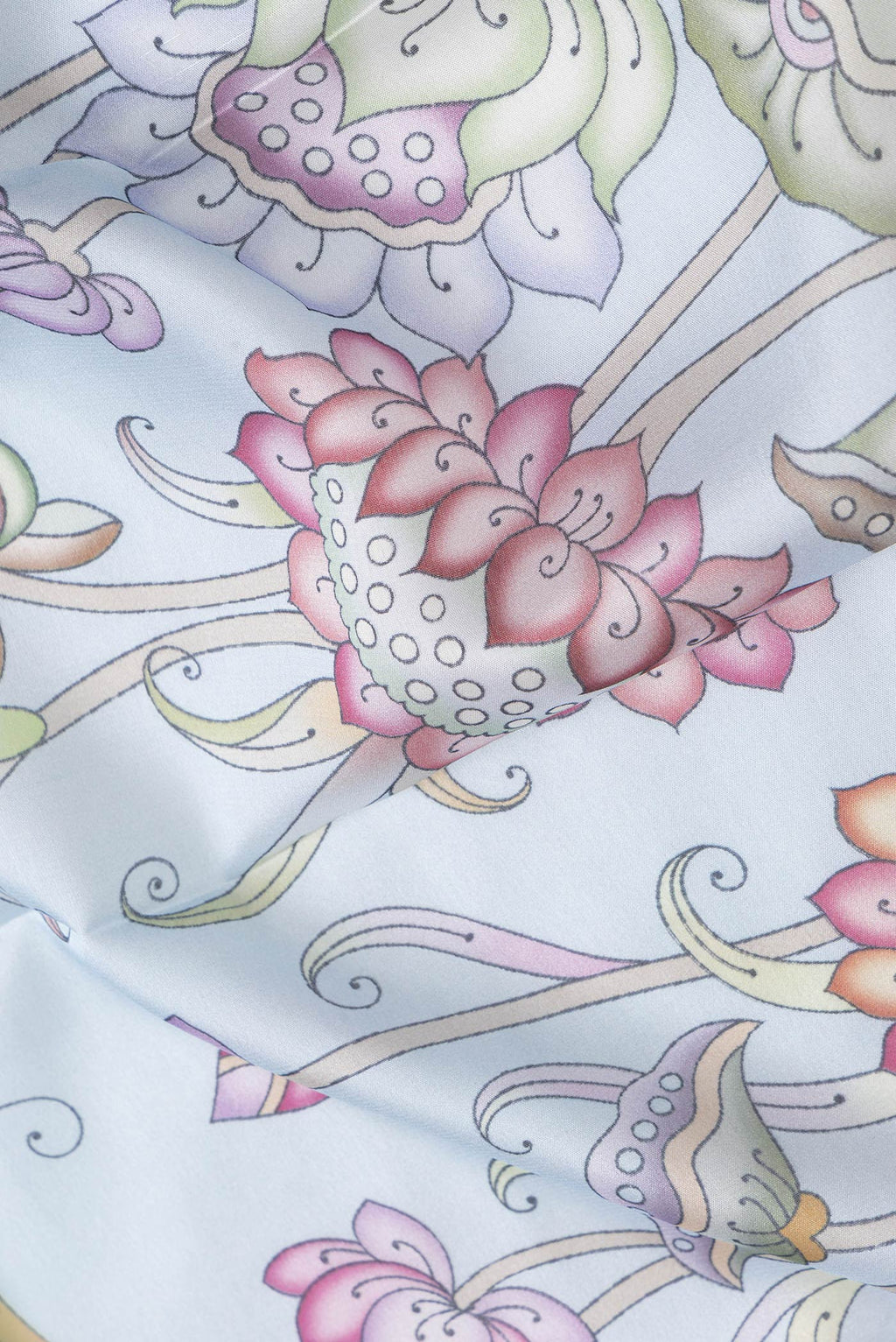 Close up of Light Blue Dual Tone Mysore Silk Saree with Printed design on the body and Zari Border.  displaying folds