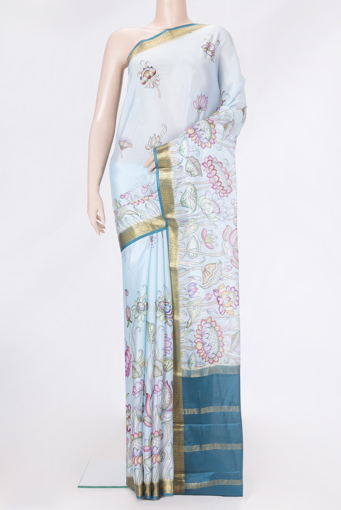 Light Blue Dual Tone Mysore Silk Saree with Printed design on the body and Zari Border.  displayed on a mannequin