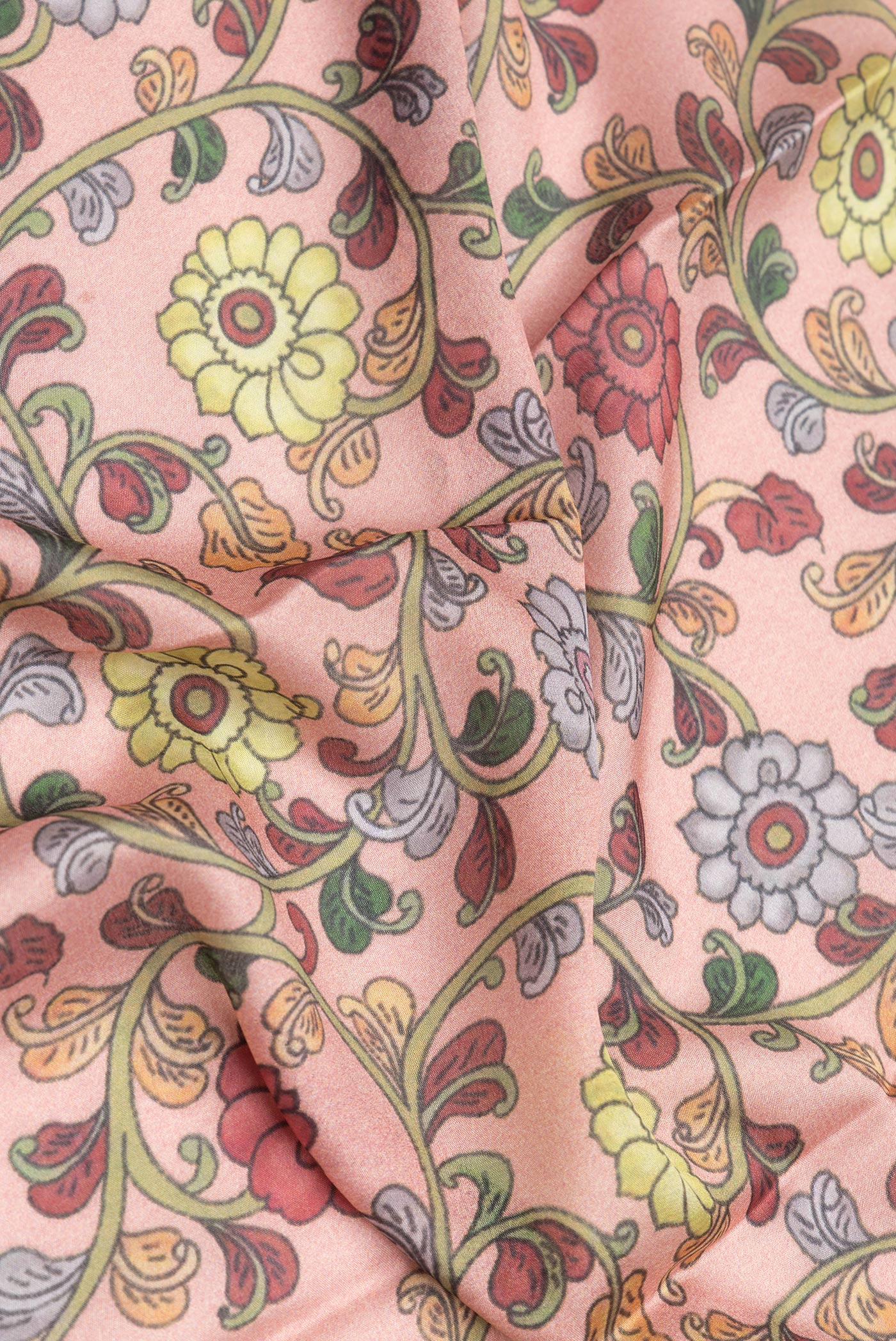 Close up of Peach Dual Tone Mysore Silk Saree with Printed design on the body and Zari Border.  displaying folds
