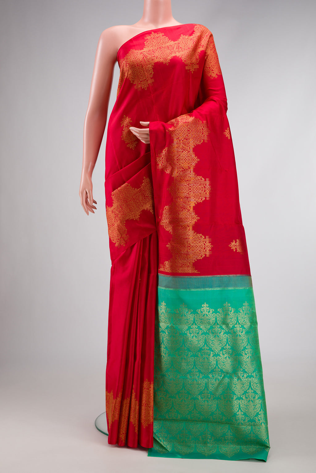 Red Dual Tone Kanjivaram Silk Saree with Zari Butta on the body and Fancy Border.  displayed on a mannequin