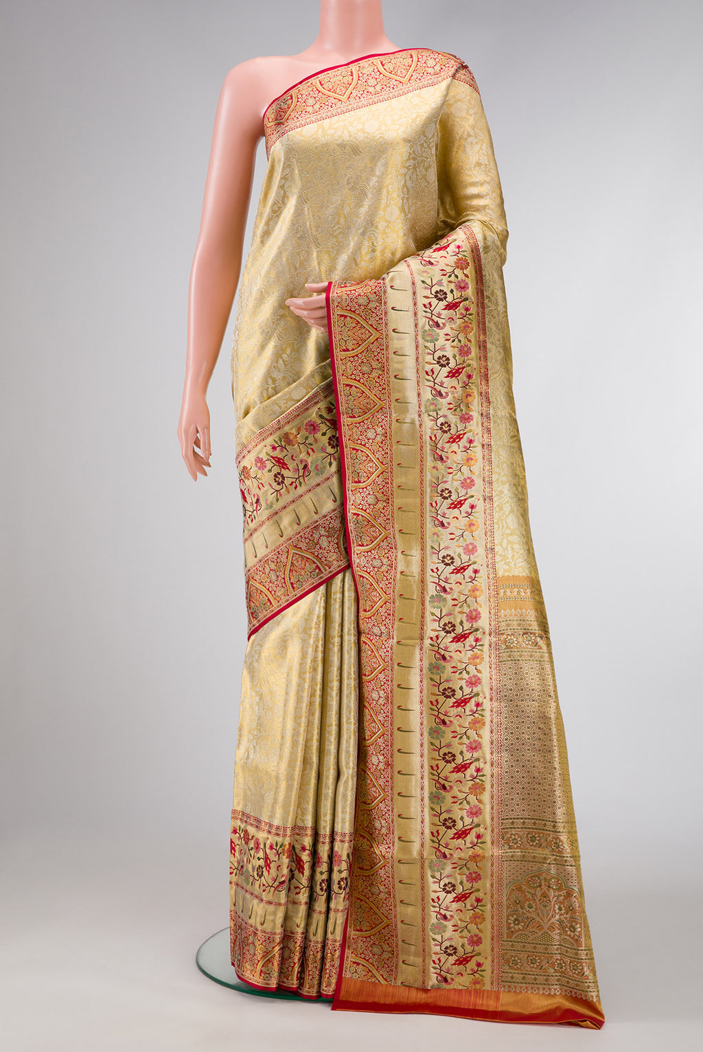 Gold Dual Tone Kanchipuram Tissue Silk Saree with Zari Brocade on the body and Fancy Border.  displayed on a mannequin