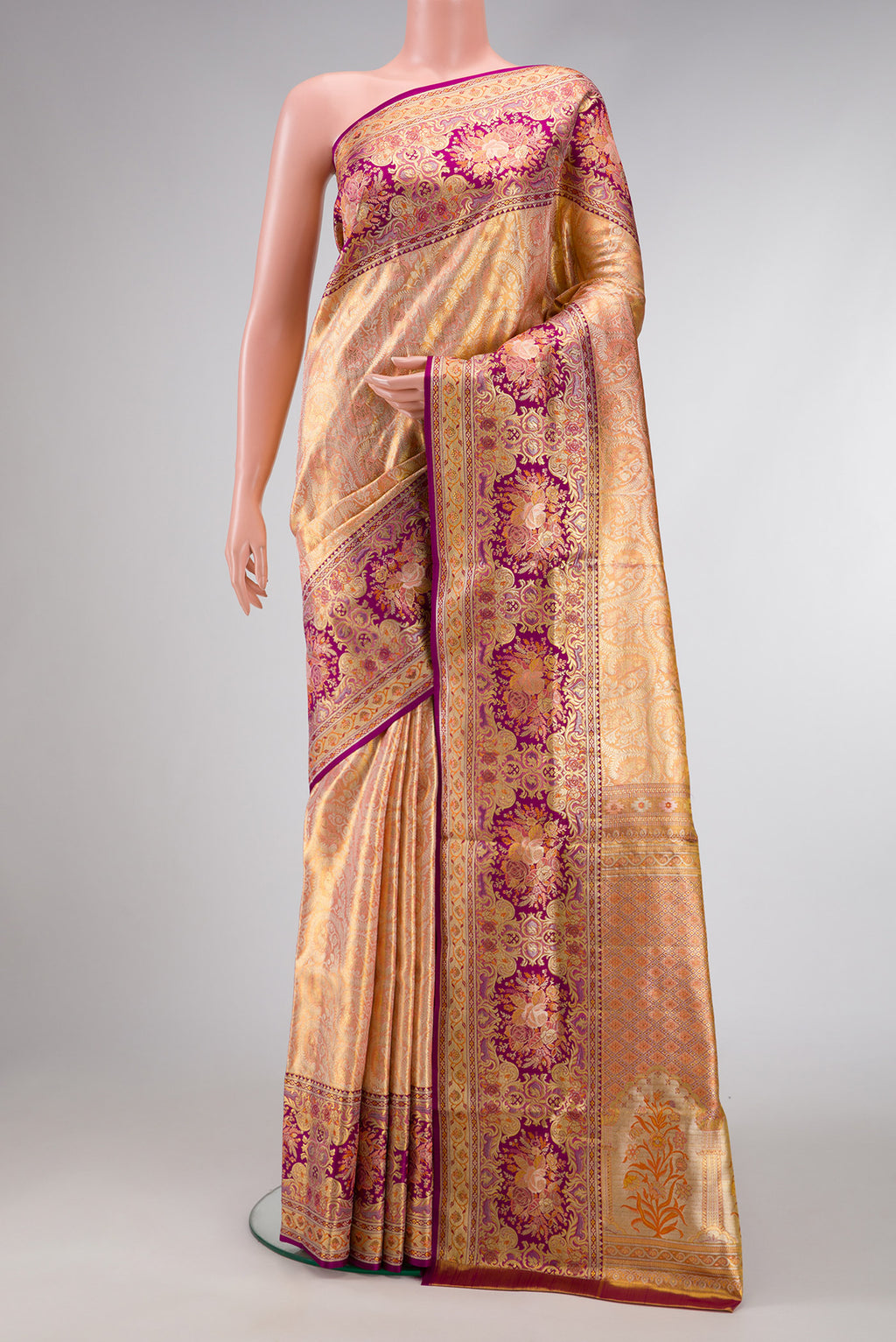 Golden Peach Dual Tone Kanchipuram Tissue Silk Saree with Zari Brocade on the body and Fancy Border.  displayed on a mannequin