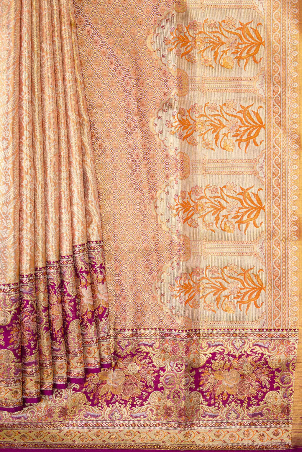 Pleats and pallu of Golden Peach Dual Tone Kanchipuram Tissue Silk Saree with Zari Brocade on the body and Fancy Border. 